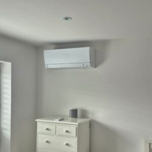 Mitsubishi air conditioning wall unit installed in a bedroom in Marple, Stockport